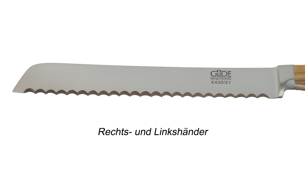 GÜDE Klinge des Brotmesser X430/21RL Alpha Olive mit 21 cm Klingenlänge und Olivenholz-Griff für Rechts- und Linkshänder auf weißem Hintergrund