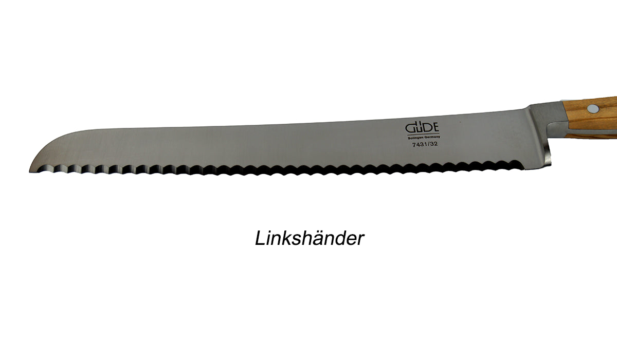 GÜDE Klinge des Brotmesser 7431/32 Alpha Olive mit 32 cm Klingenlänge und Olivenholz-Griff für Linkshänder auf weißem Hintergrund