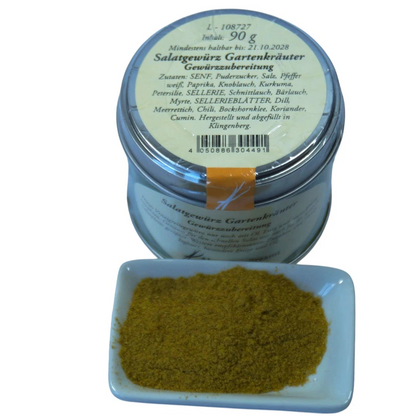Altes Gewürzamt Salatgewürz Gartenkräuter Klassische Vinaigrette-Basis, grüne Gewürzdose von oben und ein kleines Schälchen mit Gewürz auf hellem Hintergrund