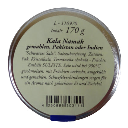 Altes Gewürzamt Kala Namak Traditionelles indisches Schwarzsalz, grüne Gewürzdose von oben auf hellem Hintergrund