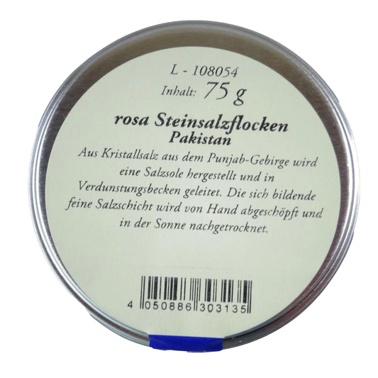 Altes Gewürzamt Rosa Steinsalzflocken, grüne Gewürzdose von oben auf hellem Hintergrund