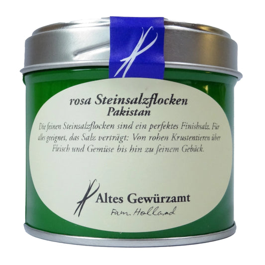 Altes Gewürzamt Rosa Steinsalzflocken, grüne Gewürzdose auf hellem Hintergrund