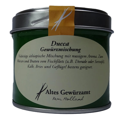 Altes Gewürzamt Ducca Traditionelle ägyptische Sesam-Kichererbsen-Mischung, grüne Gewürzdose auf hellem Hintergrund