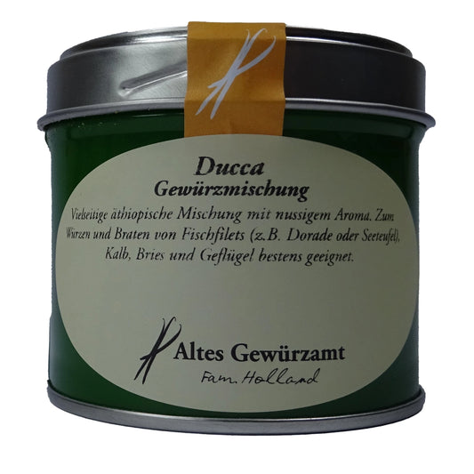 Altes Gewürzamt Ducca Traditionelle ägyptische Sesam-Kichererbsen-Mischung, grüne Gewürzdose auf hellem Hintergrund