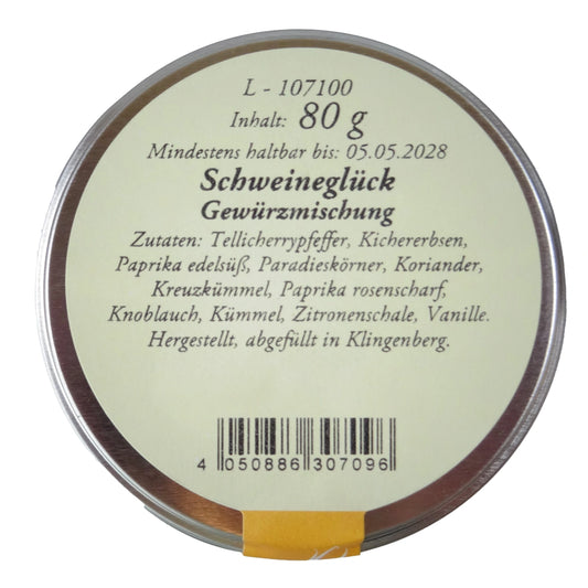 Altes Gewürzamt Schweineglück Premium-BBQ-Rub, grüne Gewürzdose von oben auf hellem Hintergrund