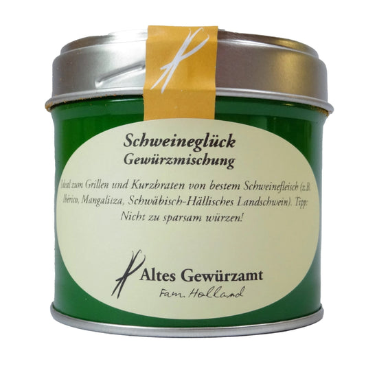 Altes Gewürzamt Schweineglück Premium-BBQ-Rub, grüne Gewürzdose auf hellem Hintergrund