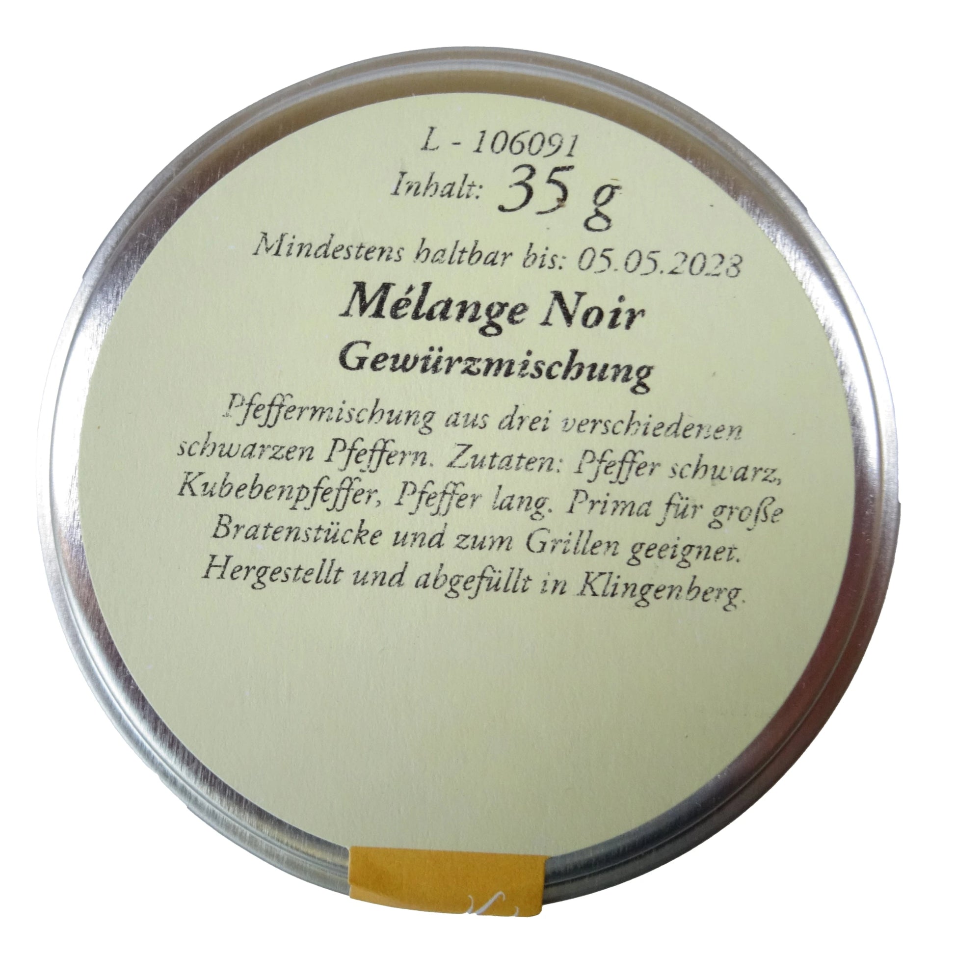 Altes Gewürzamt Mélange Noir Kraftvolle schwarze Premium-Pfeffermischung, kleine grüne Gewürzdose von oben auf hellem Hintergrund