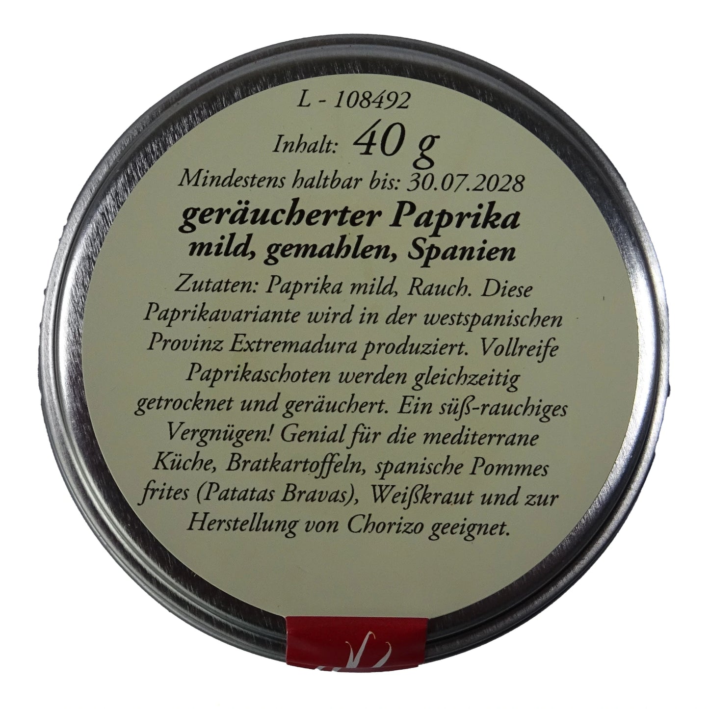 Altes Gewürzamt Geräucherter Paprika mild Pimentón de la Vera Dulce, grüne Gewürzdose Ansicht Deckel auf hellem Hintergrund