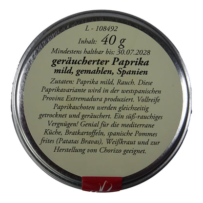 Altes Gewürzamt Geräucherter Paprika mild Pimentón de la Vera Dulce, grüne Gewürzdose Ansicht Deckel auf hellem Hintergrund