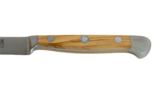 GÜDE Griff des Steakmesser glatte Schneide Alpha Olive X113/12 mit 12 Klingenlänge und Olivenholz-Grif auf weißem Hintergrund