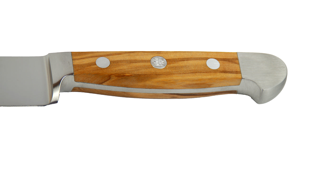 GÜDEGriff des Schinkenmesser Alpha Olive X765 mi 21 cm Klingenlänge und Olivenholz-Griff auf weißem Hintergrund